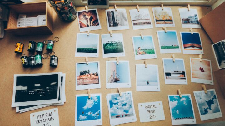 assorted photos on beige wooden table